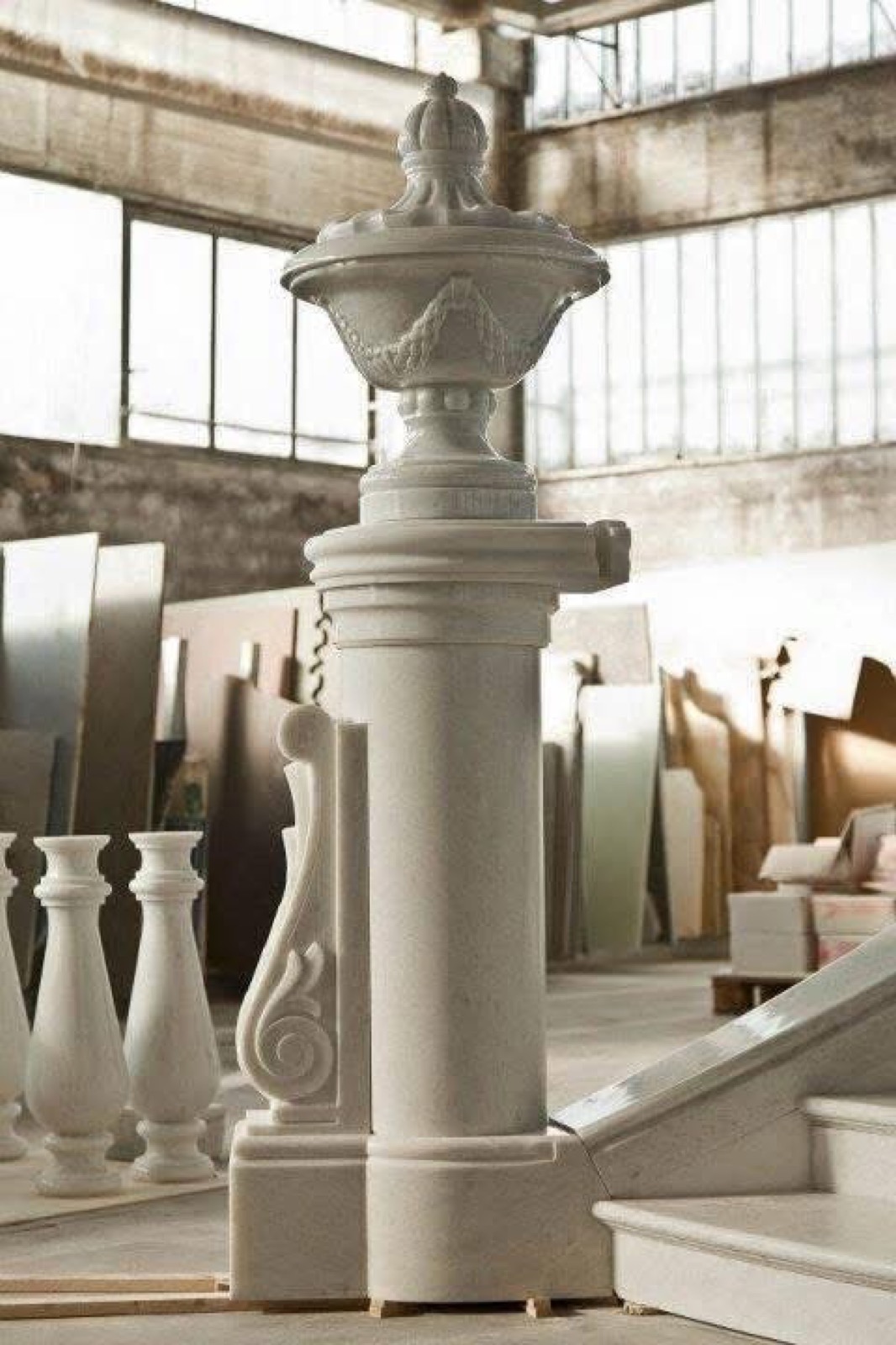 Carved newel and urn
